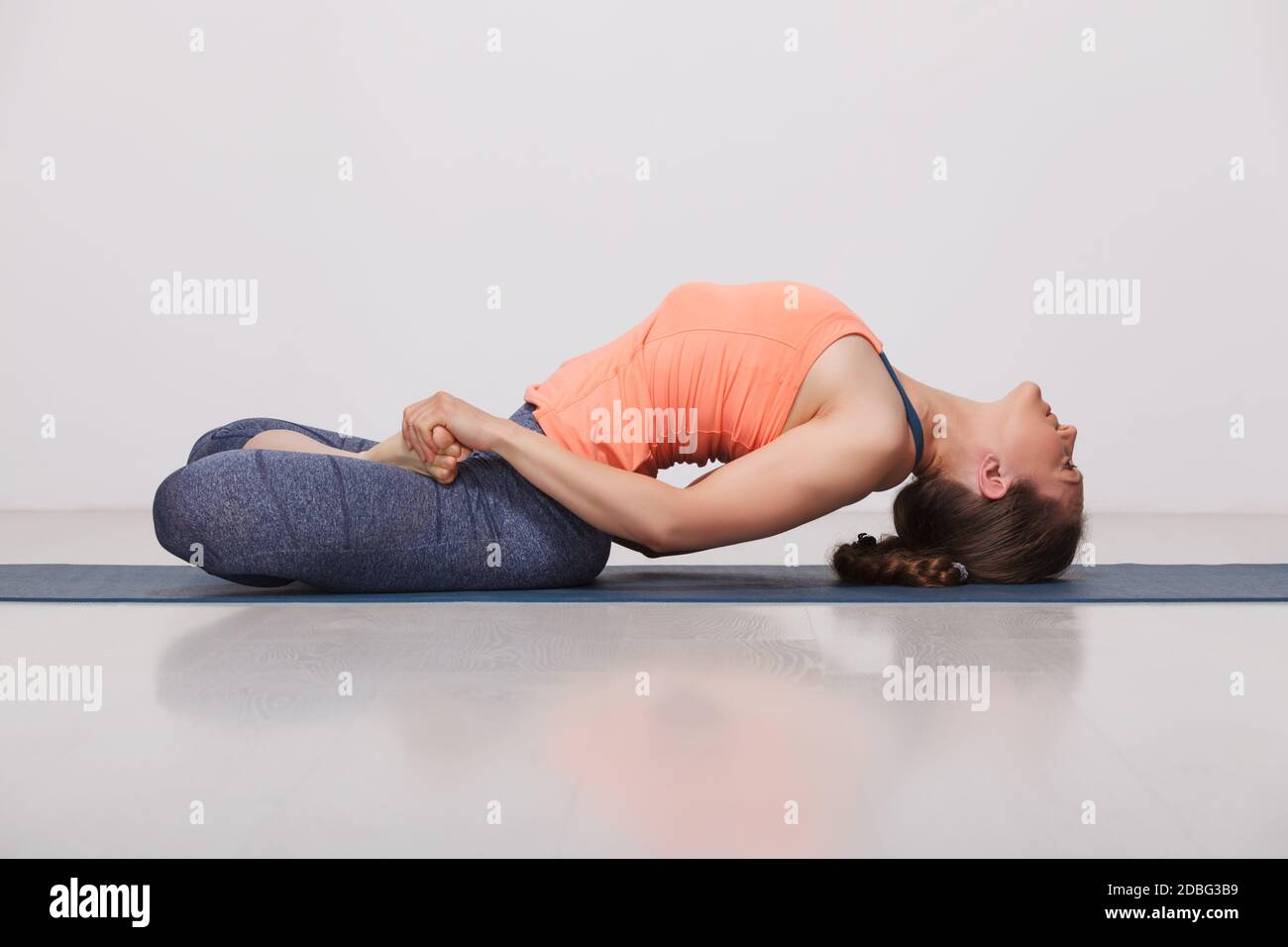 Beautiful Sporty Fit Yogini Woman Practices Yoga Asana Matsyasana beautiful-sporty-fit-yogini-woman-practices-yoga-asana-matsyasana