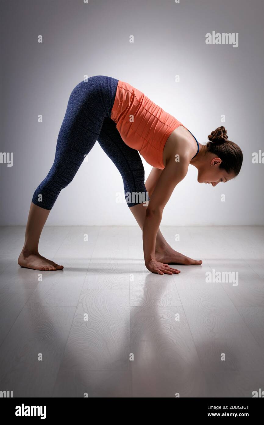 Sporty fit woman stretching in Ashtanga Vinyasa yoga asana