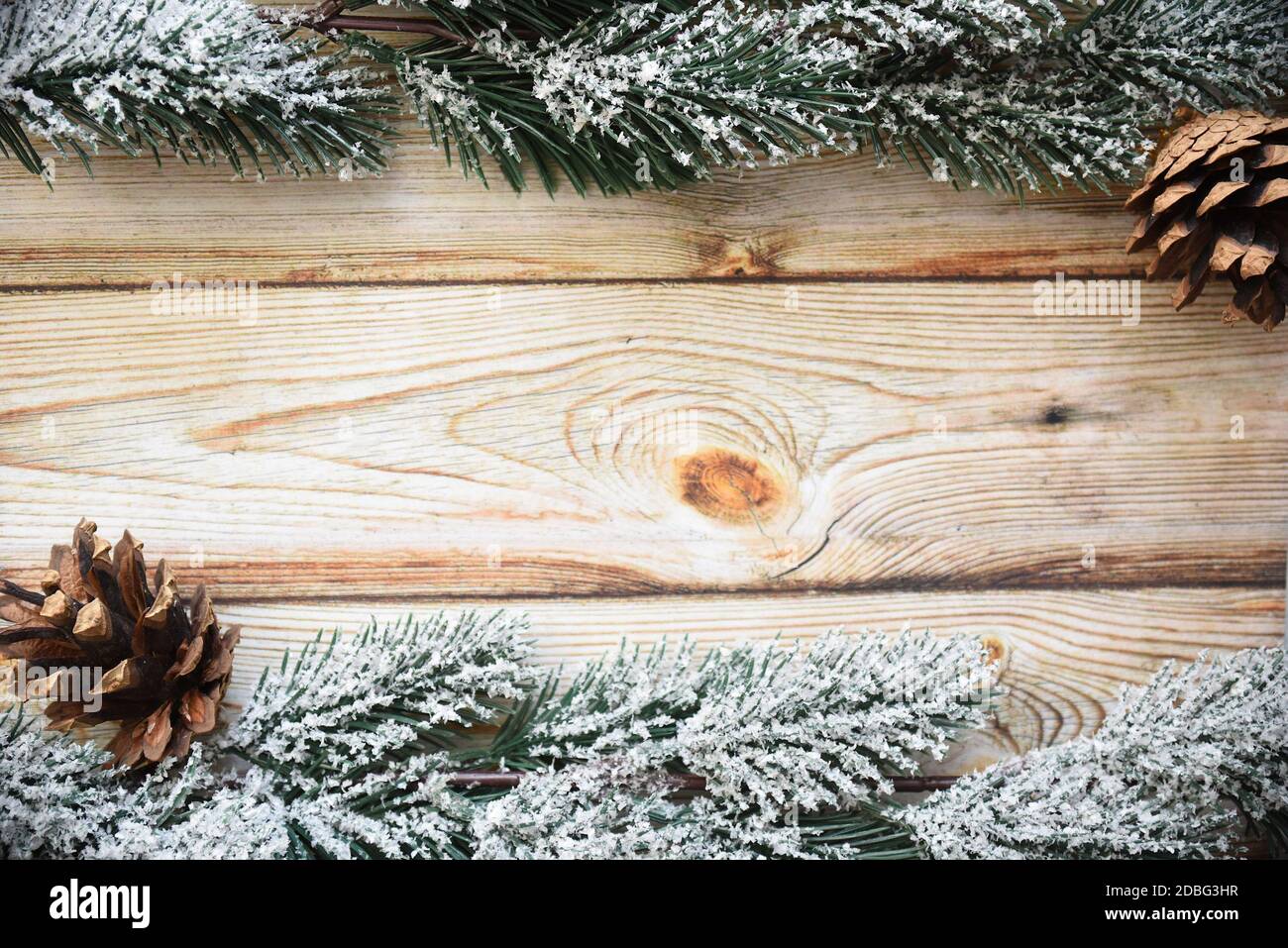 Wooden Christmas background frame with snowy fir tree branches and ...