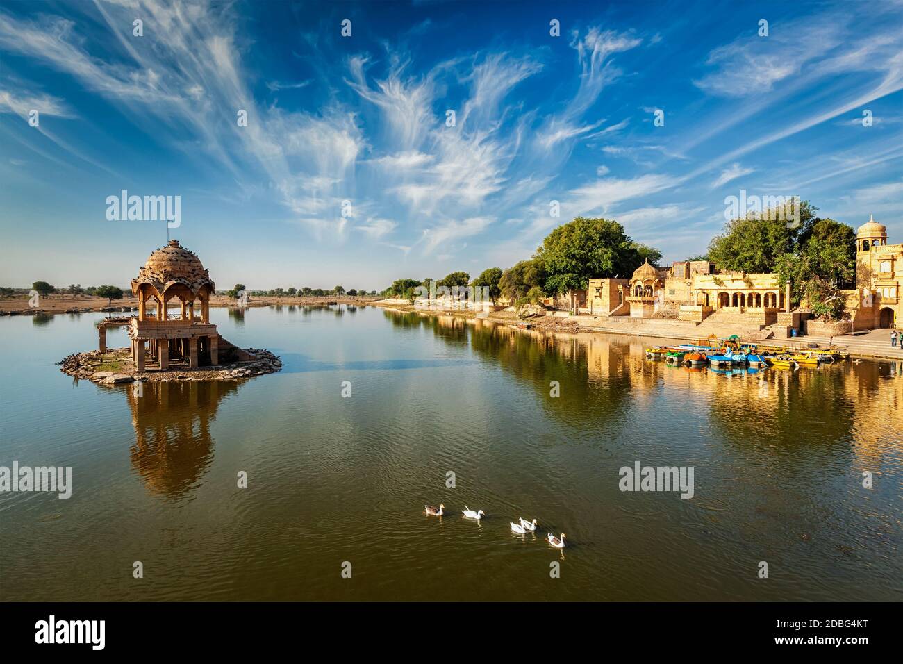 Indian landmark Gadi Sagar - artificial lake with white swans. Jaisalmer, Rajasthan, India Stock Photo