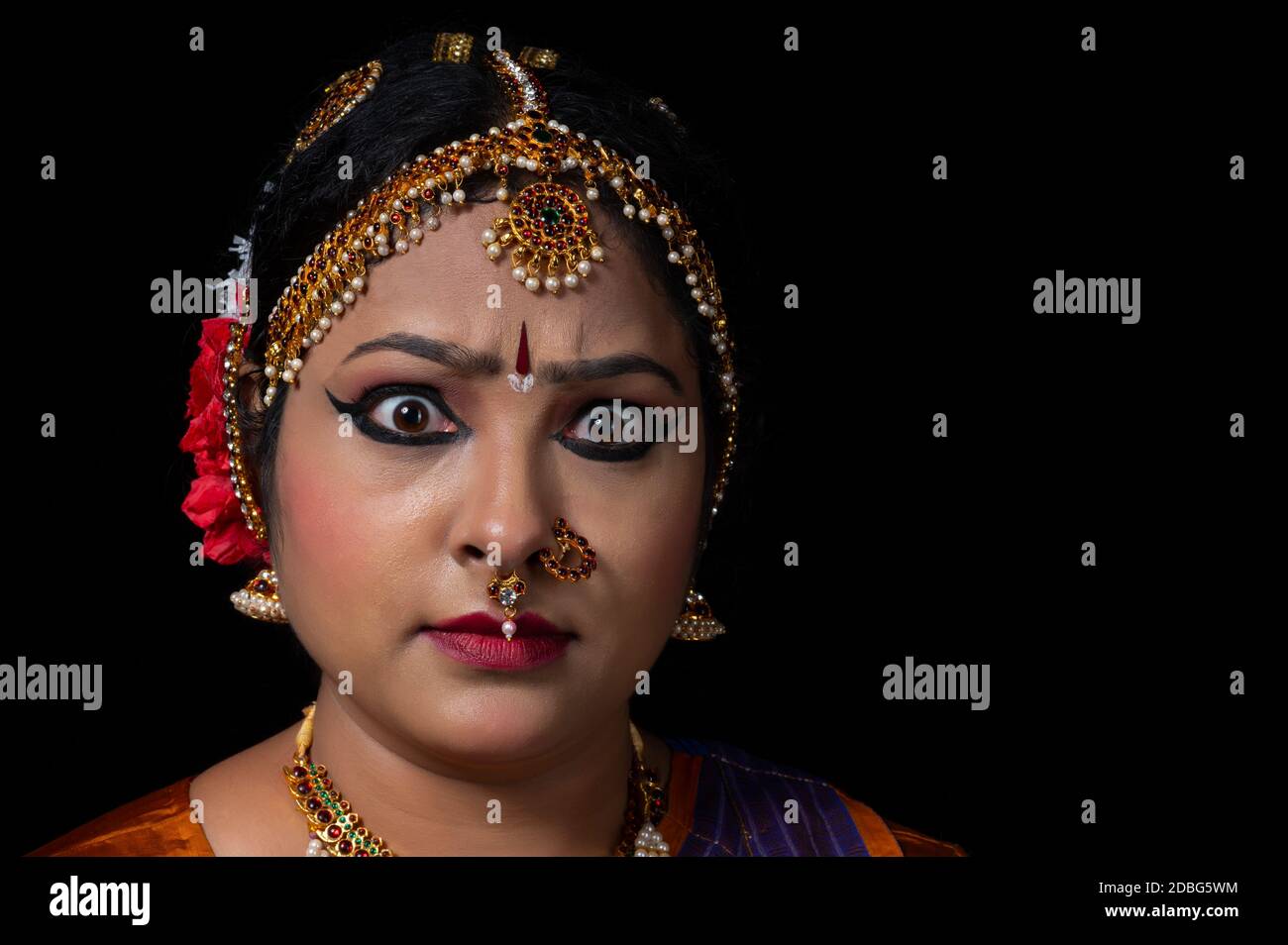 Kuchipudi dancer showing Raudra Rasa in her performance Stock Photo - Alamy