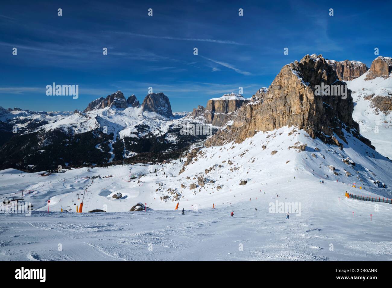 View of a ski resort piste with people skiing in Dolomites in Italy. Ski  area Belvedere. Canazei, Italy Stock Photo - Alamy