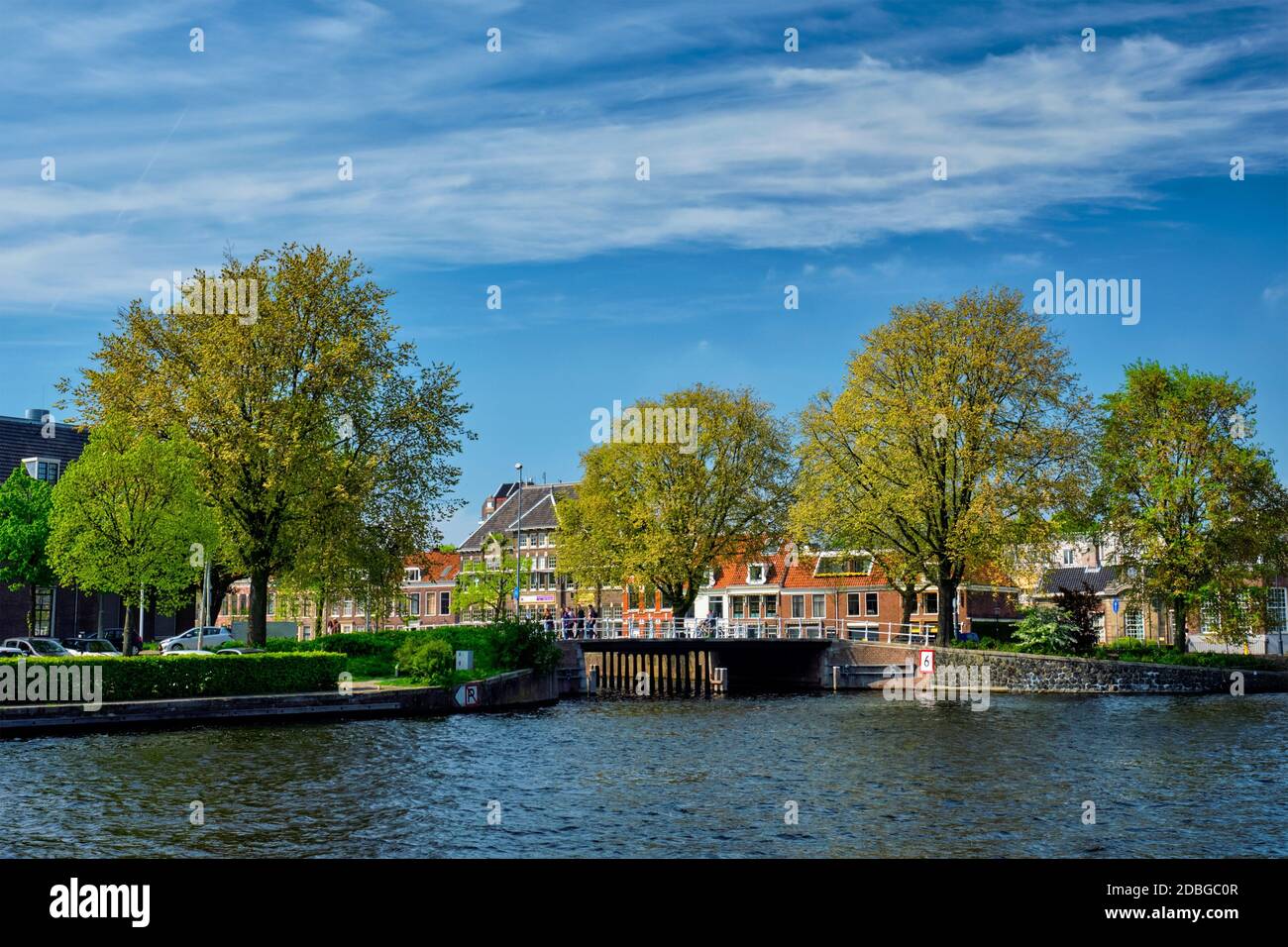 Canal and Spaarne river and houses in Haarlem, Netherlands Stock Photo