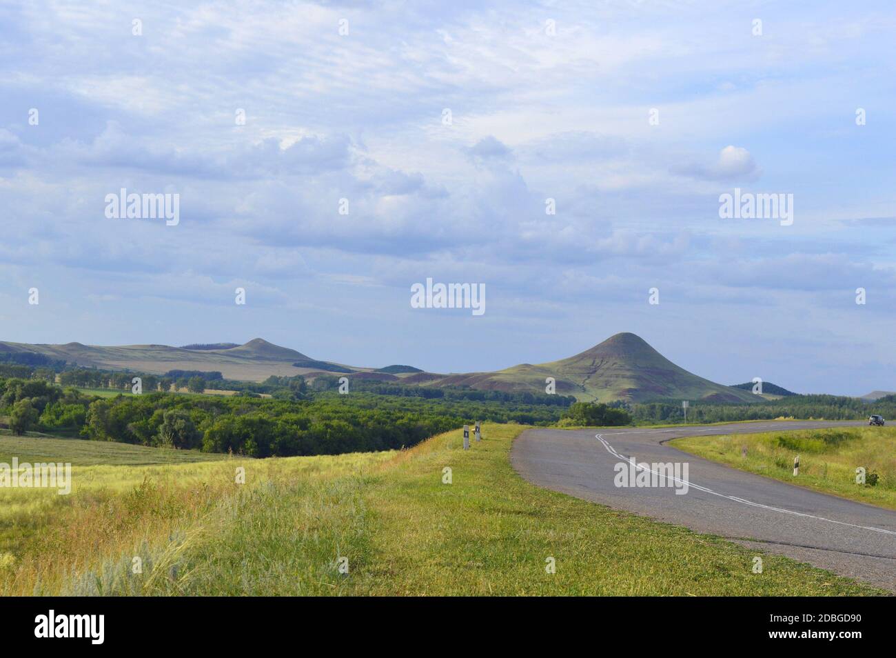 summer landscape with road, mountain and blue sky with clouds Stock ...