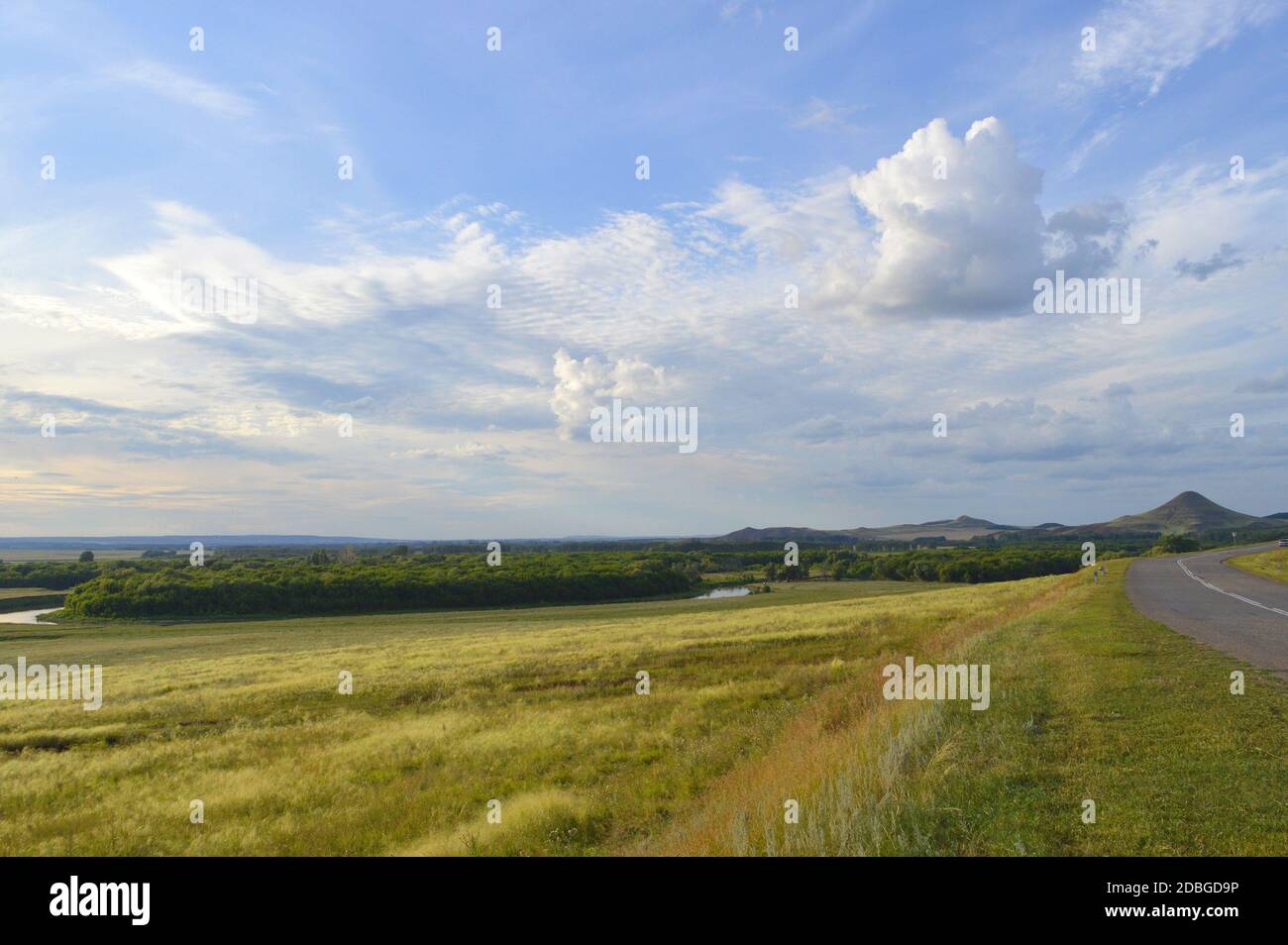 summer landscape with road, mountain and blue sky with clouds Stock ...
