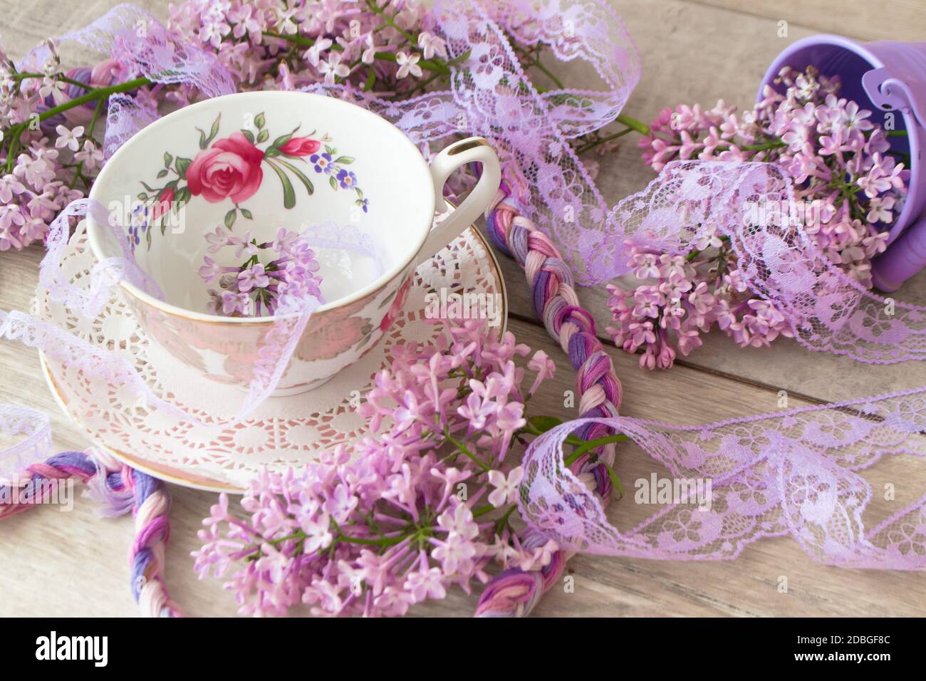 Vintage cup of tea with violet blooming branch of lilac, background for ...