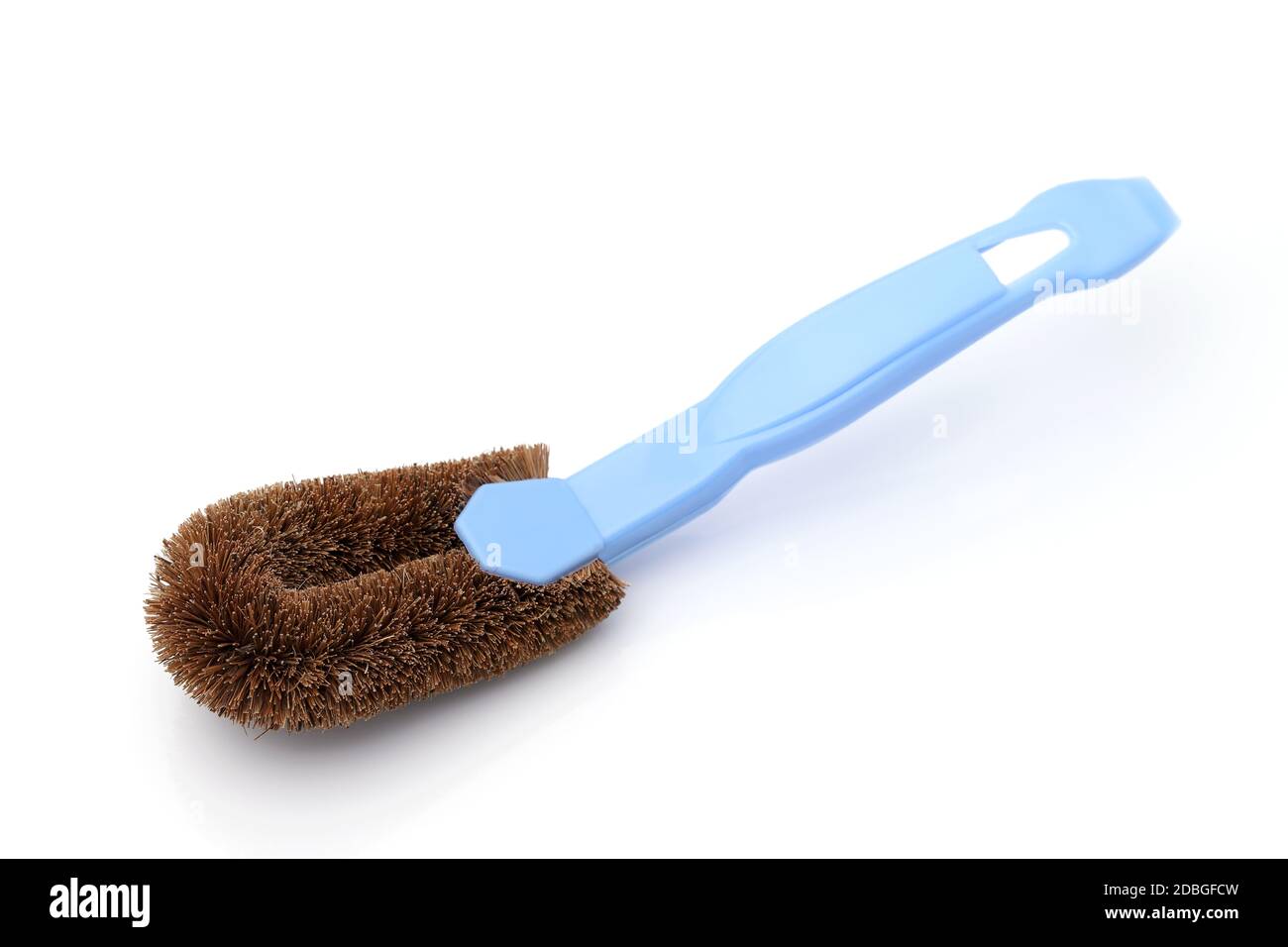 Coconut coir fiber scrubbing brush with handle on white background Stock Photo