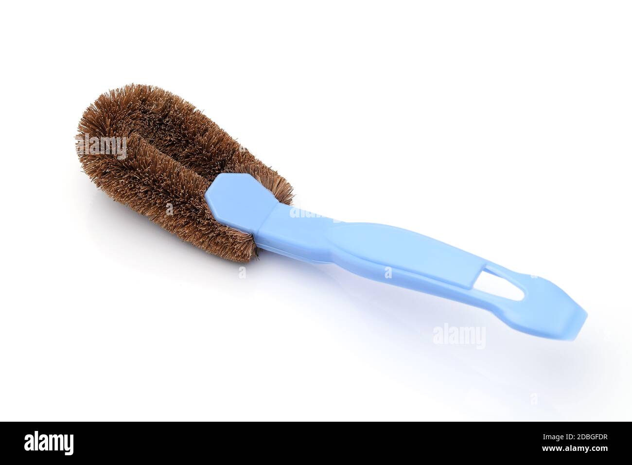 Coconut coir fiber scrubbing brush with handle on white background Stock Photo