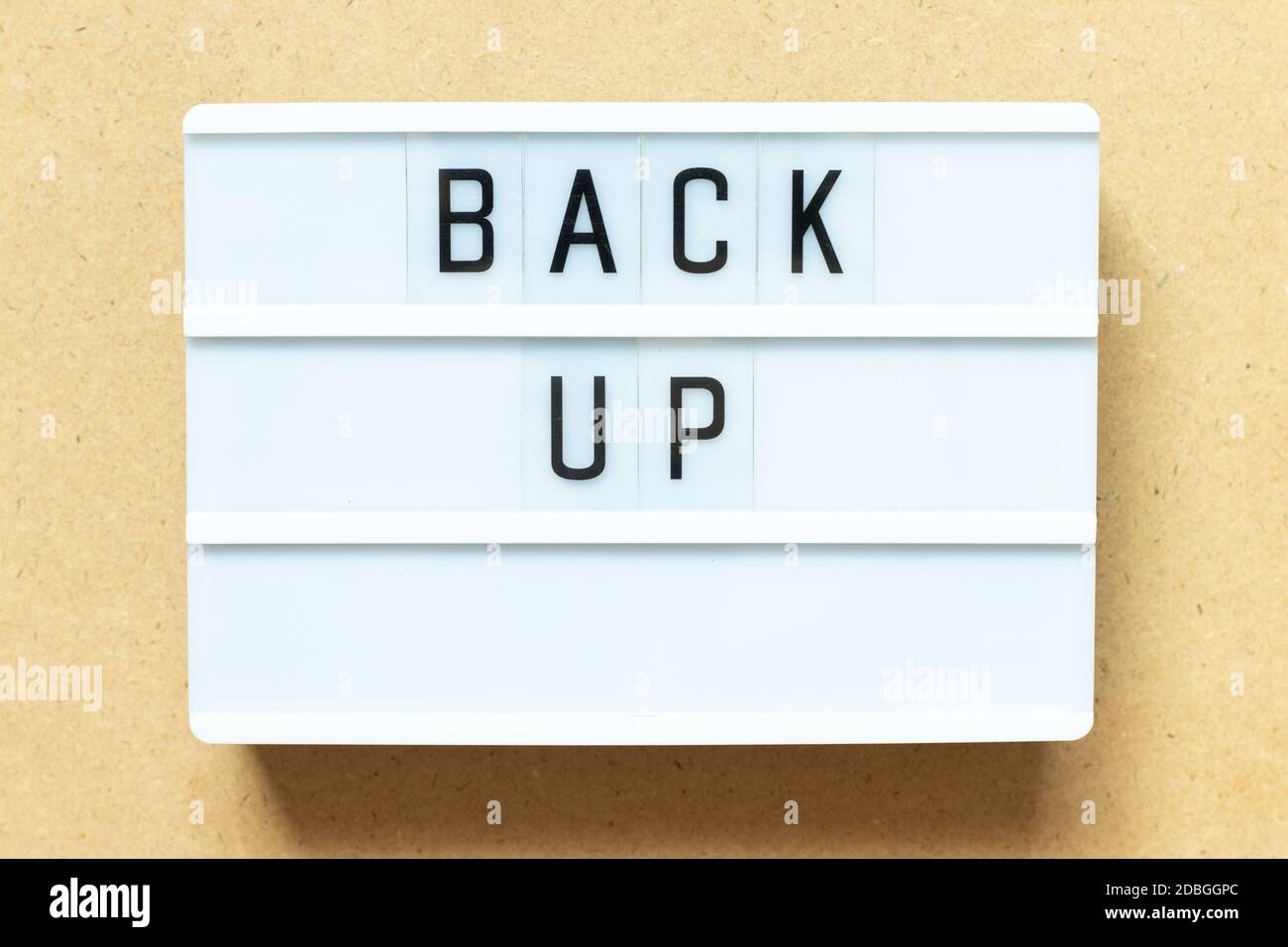 Lightbox with word back up on wood background Stock Photo