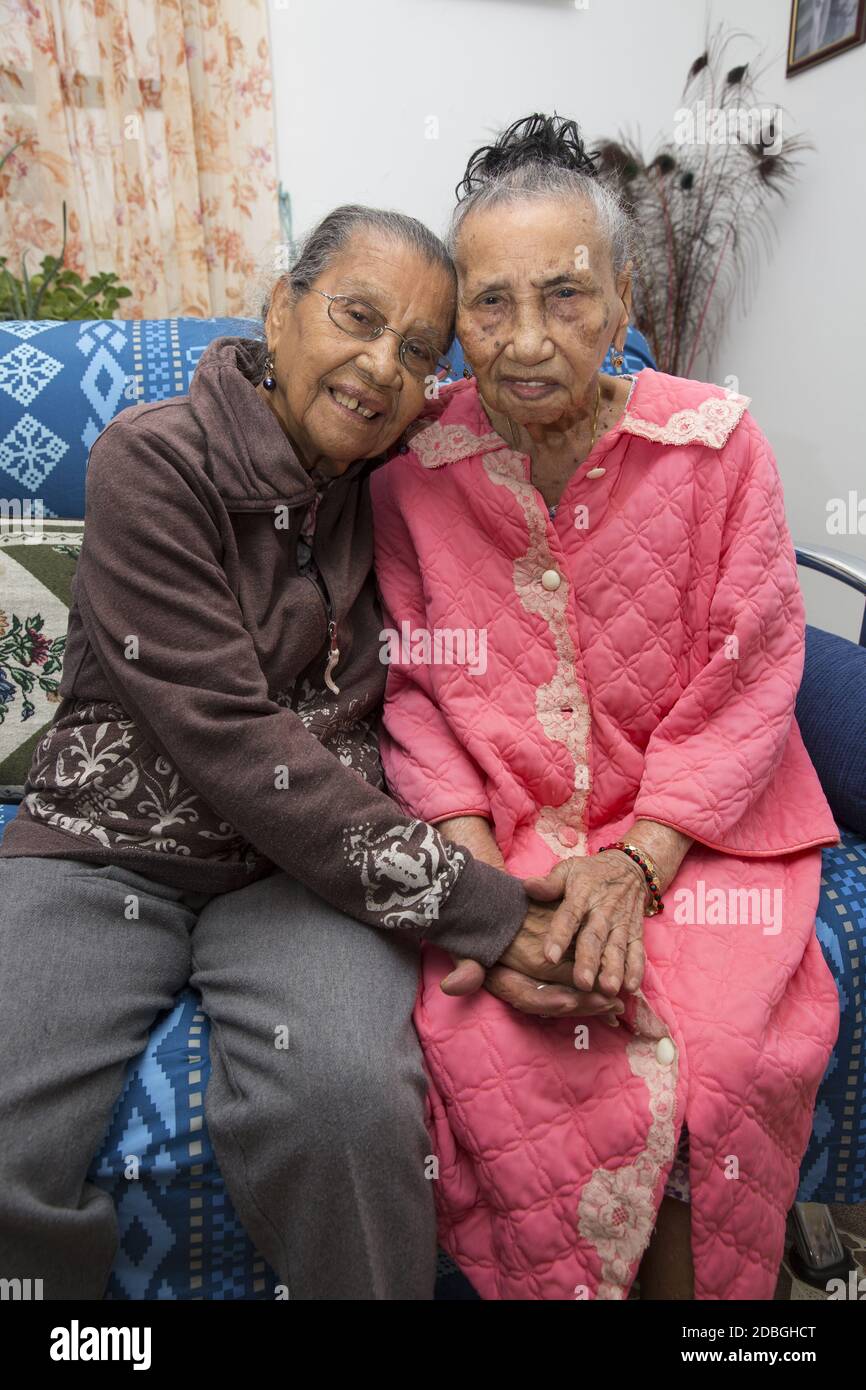 Portrait of sisters, originally from Puerto Rico, 101 (R) and 99 (L) in East Harlem, New York City. Stock Photo