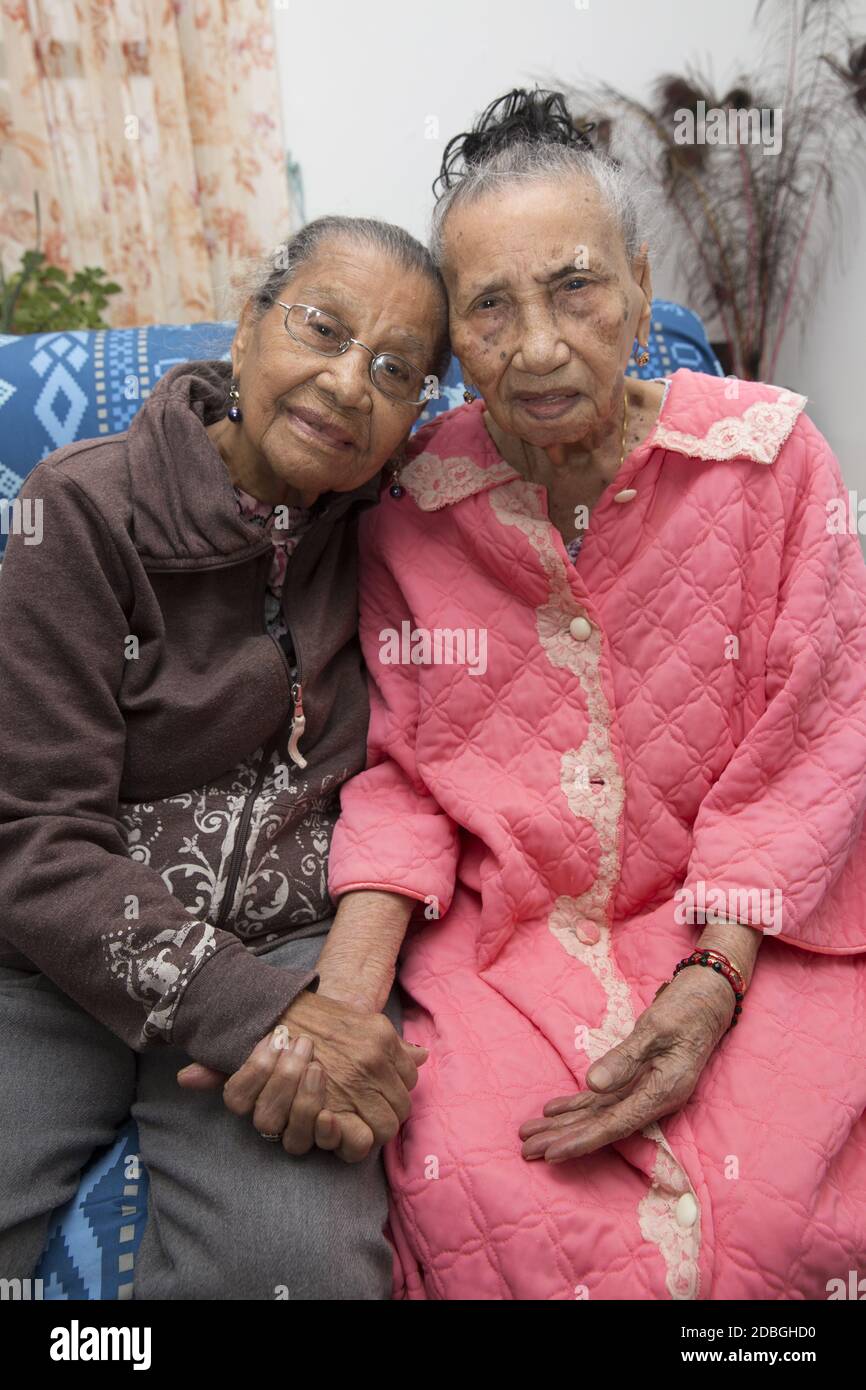 Portrait of sisters, originally from Puerto Rico, 101 (R) and 99 (L) in East Harlem, New York City. Stock Photo