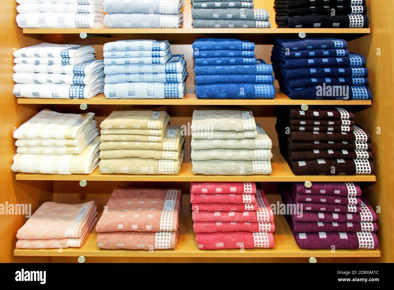 Pile of colorful towels at big racks Stock Photo - Alamy
