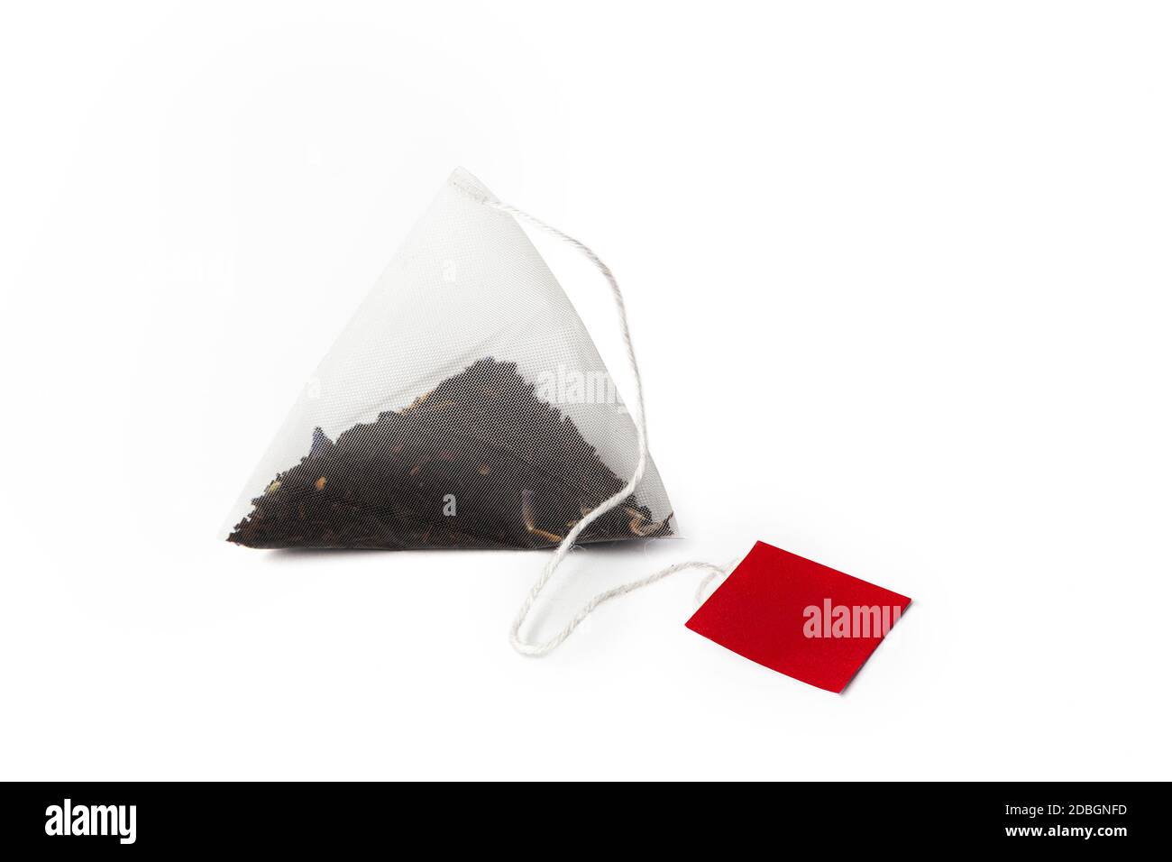 Pyramid shape teabag close up isolated on the white background Stock Photo