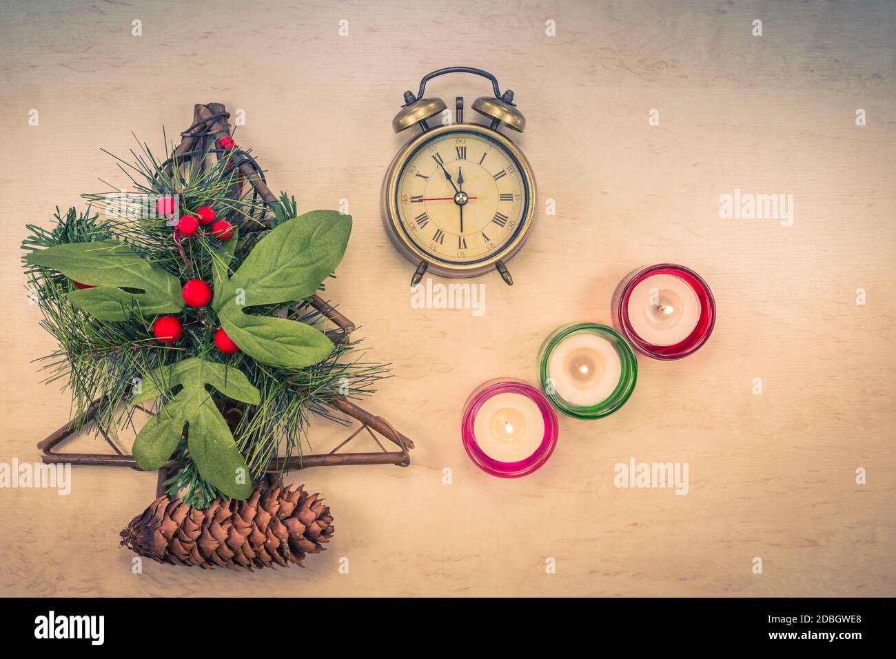 Christmas decoration on table with burning candles, Christmas tree