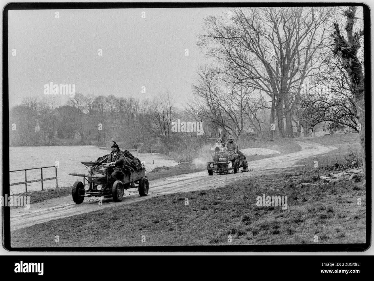 East Germany 1990 scanned in 2020 Home made transport at Gartz now in Brandenburg on the River Oder showing the bridge destroyed in WW2. Poland is on theopposite river bank. East Germany, Deutsche Demokratische Republik the DDR after the fall of the Wall but before reunification March 1990 and scanned in 2020.East Germany, officially the German Democratic Republic, was a country that existed from 1949 to 1990, the period when the eastern portion of Germany was part of the Eastern Bloc during the Cold War. Stock Photo