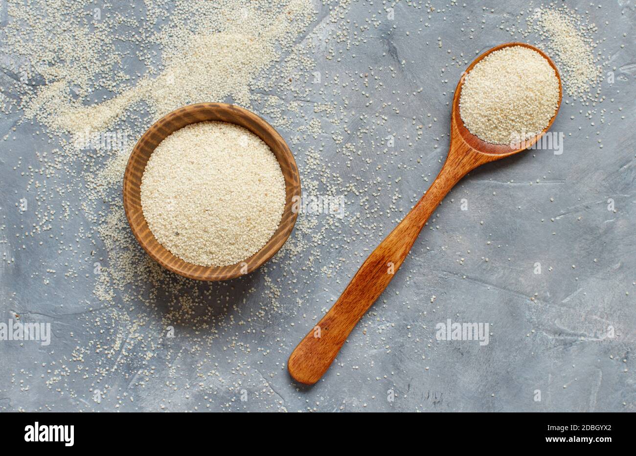 Raw uncooked fonio seeds on grey background top view Stock Photo