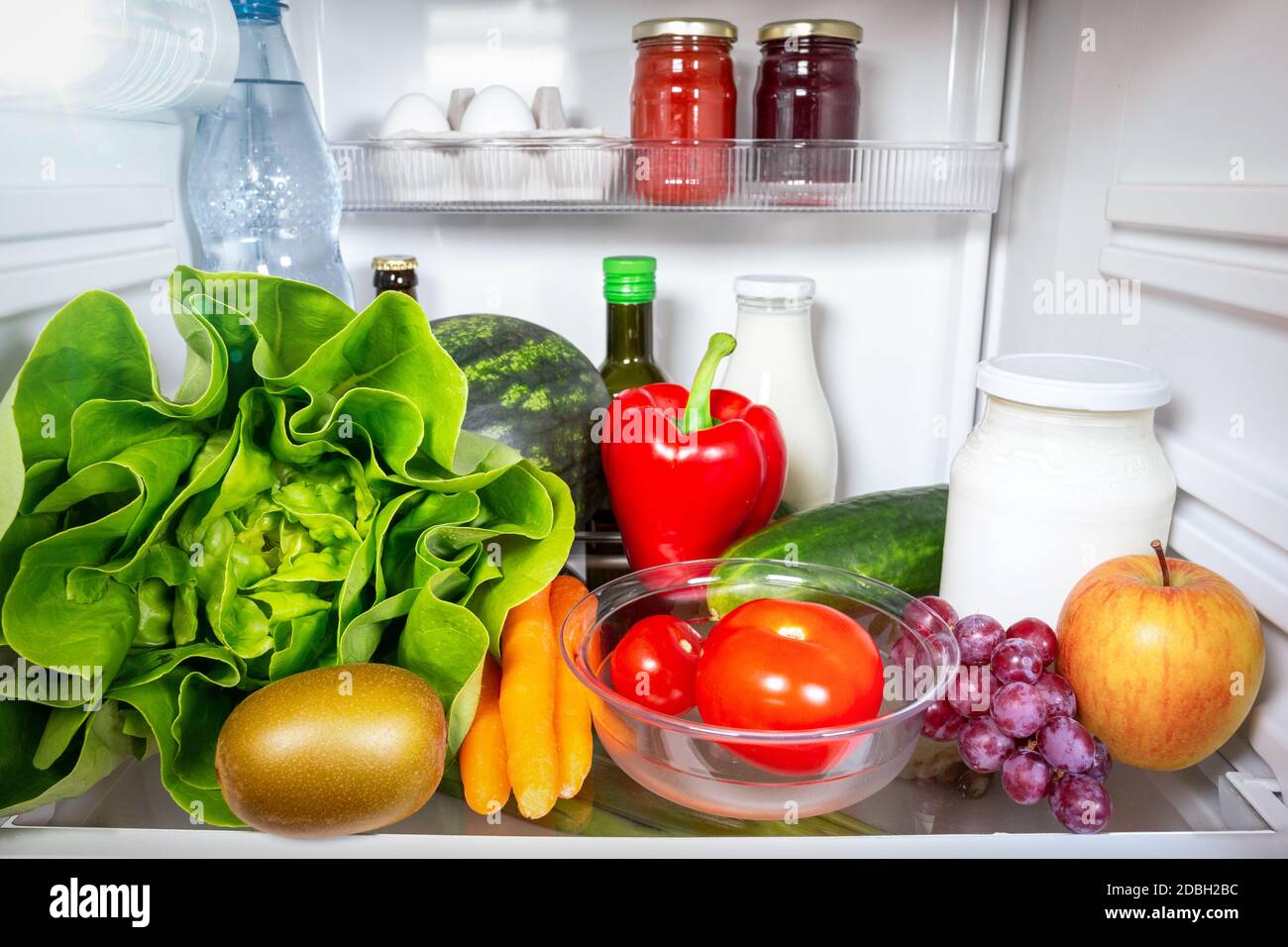 Variety of healthy foods inside a fridge Stock Photo