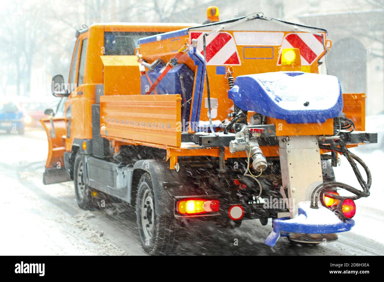 Snow plow truck with salt and grit spreader Stock Photo - Alamy