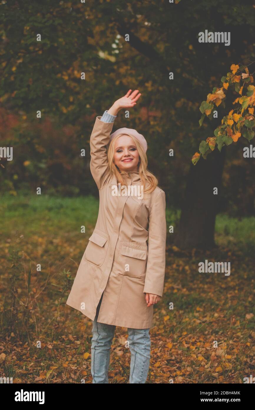 Happy autumn woman on fall nature background Stock Photo - Alamy