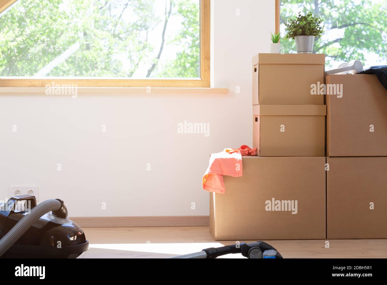 Move. Cardboard boxes for moving into a new, clean home. In a sunny day