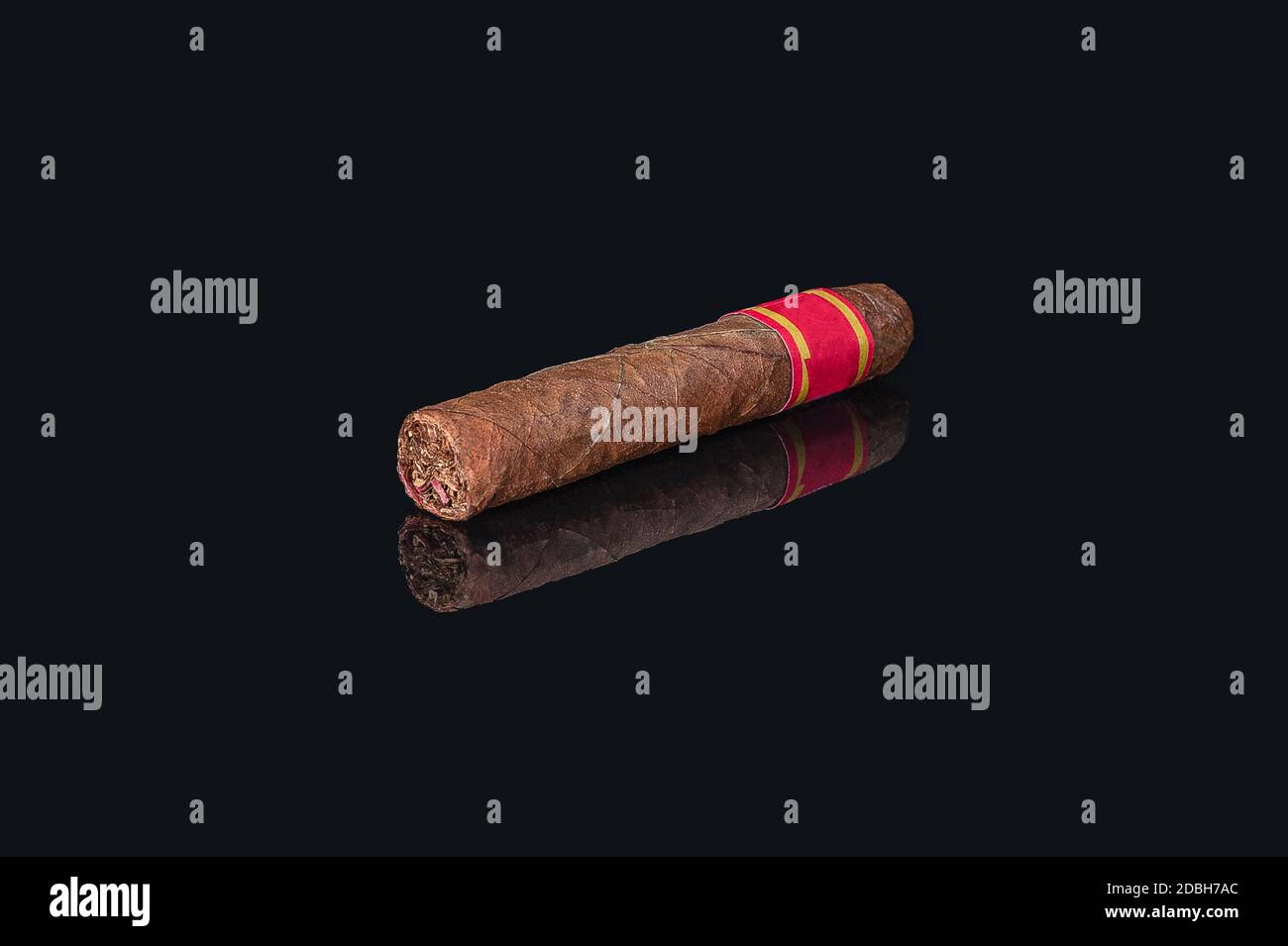 rolled bundle cuban cigar on isolated black background with reflection Stock Photo