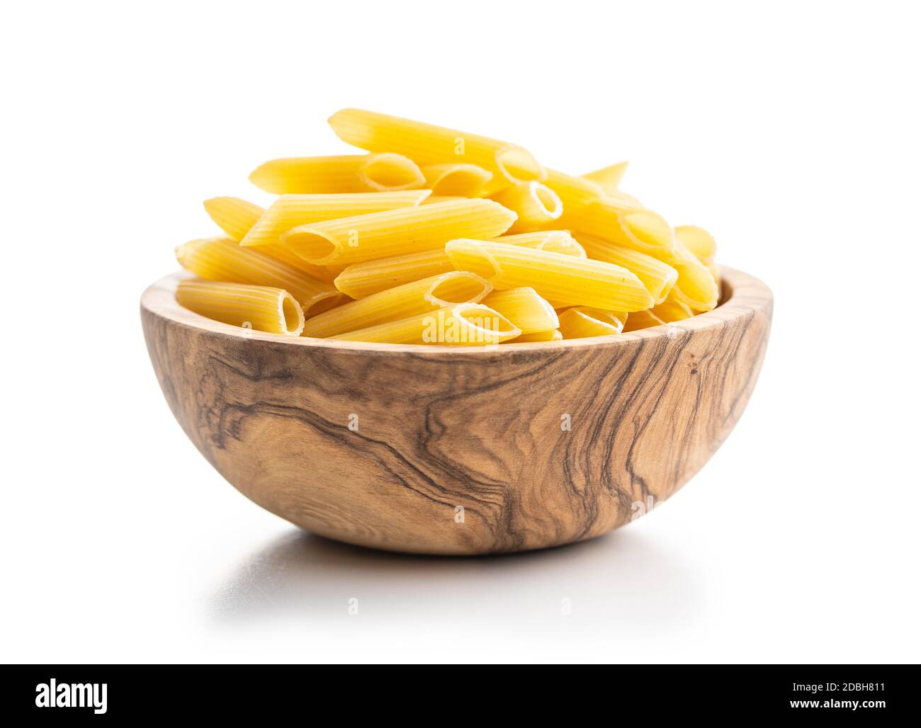 Uncooked penne pasta in bowl. Dried italian pasta isolated on white  background Stock Photo - Alamy