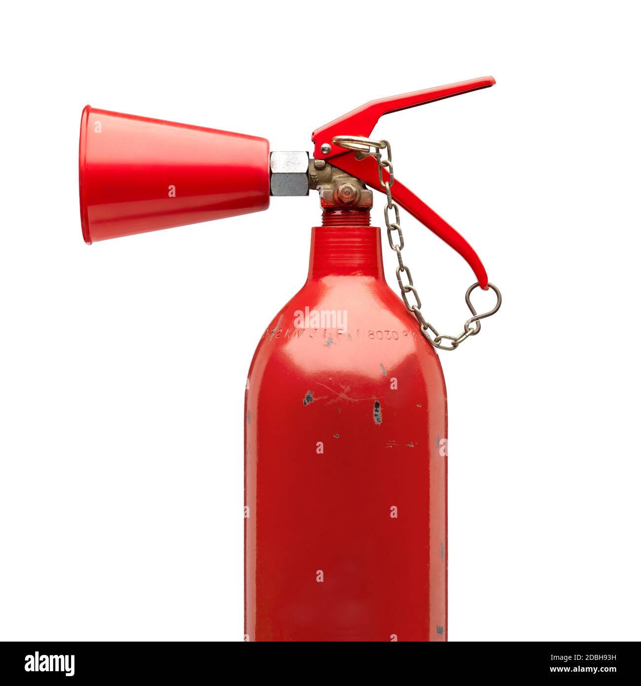 Side view of an old and roughed fire extinguisher with safety chain.Clipping path Stock Photo