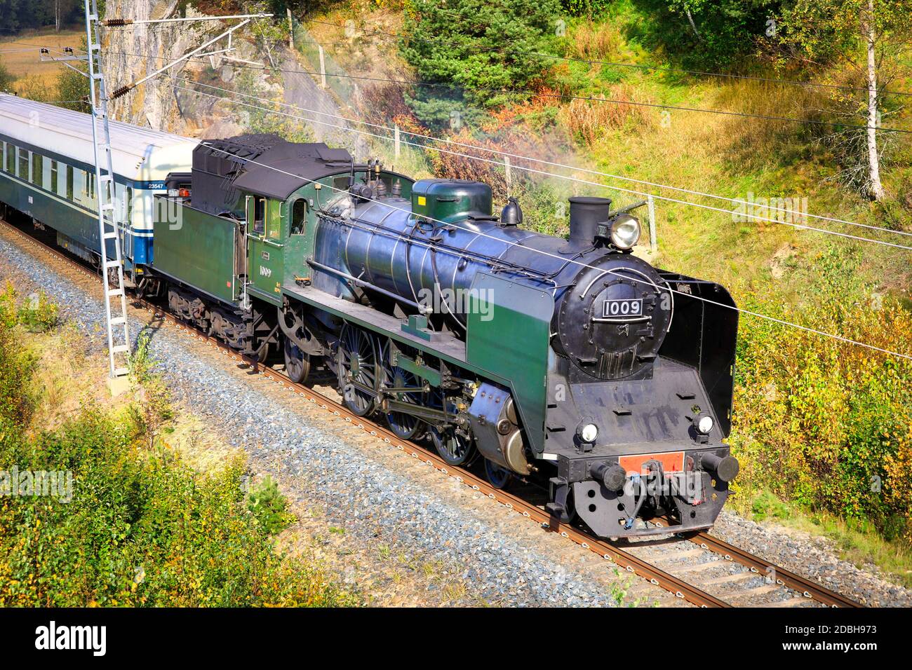 Hr1 class steam locomotive Ukko-Pekka 1009 at speed shortly after departing Salo, Finland September 18, 2020. Elevated view. Stock Photo