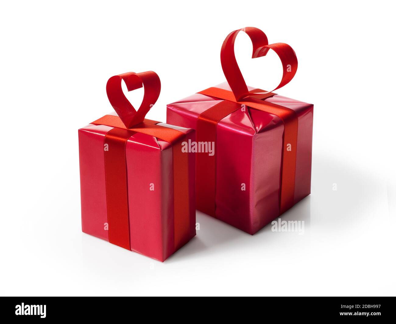 Red gift box with red hart shaped ribbon bow, isolated on white Stock ...
