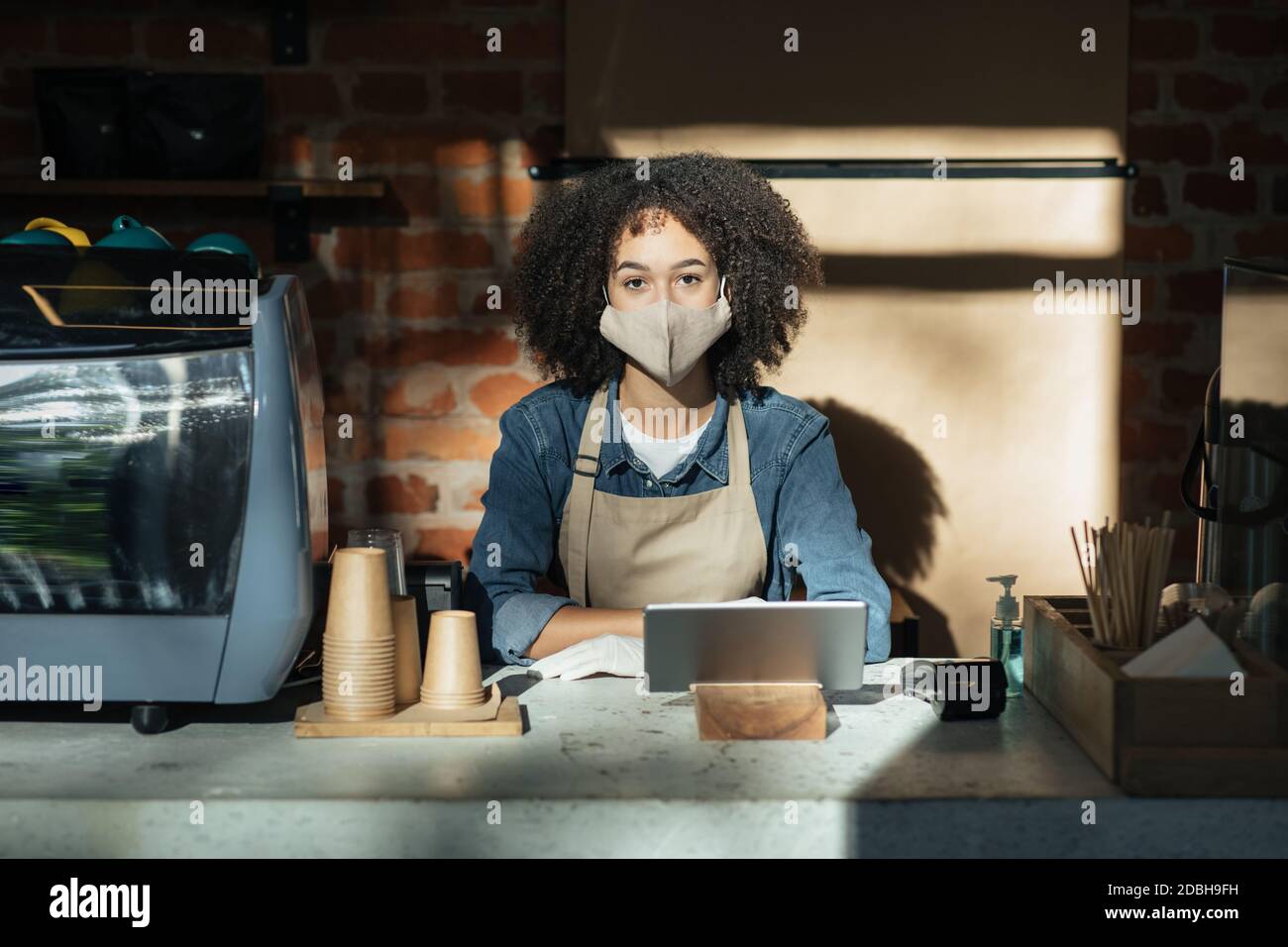 Modern technology for work during social distance and coronavirus quarantine in cafe Stock Photo