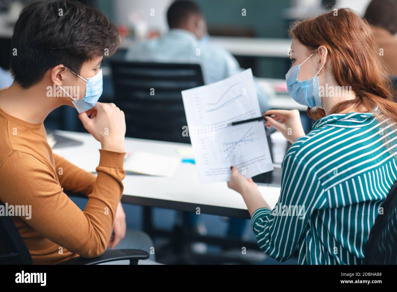 International students wearing medical masks and talking Stock Photo