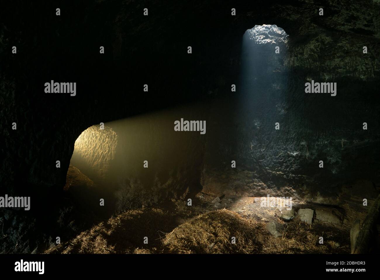 Underground with rays of light, ancient cave dwelling in the Viterbo area (Lazio, Italy, Europe) Stock Photo