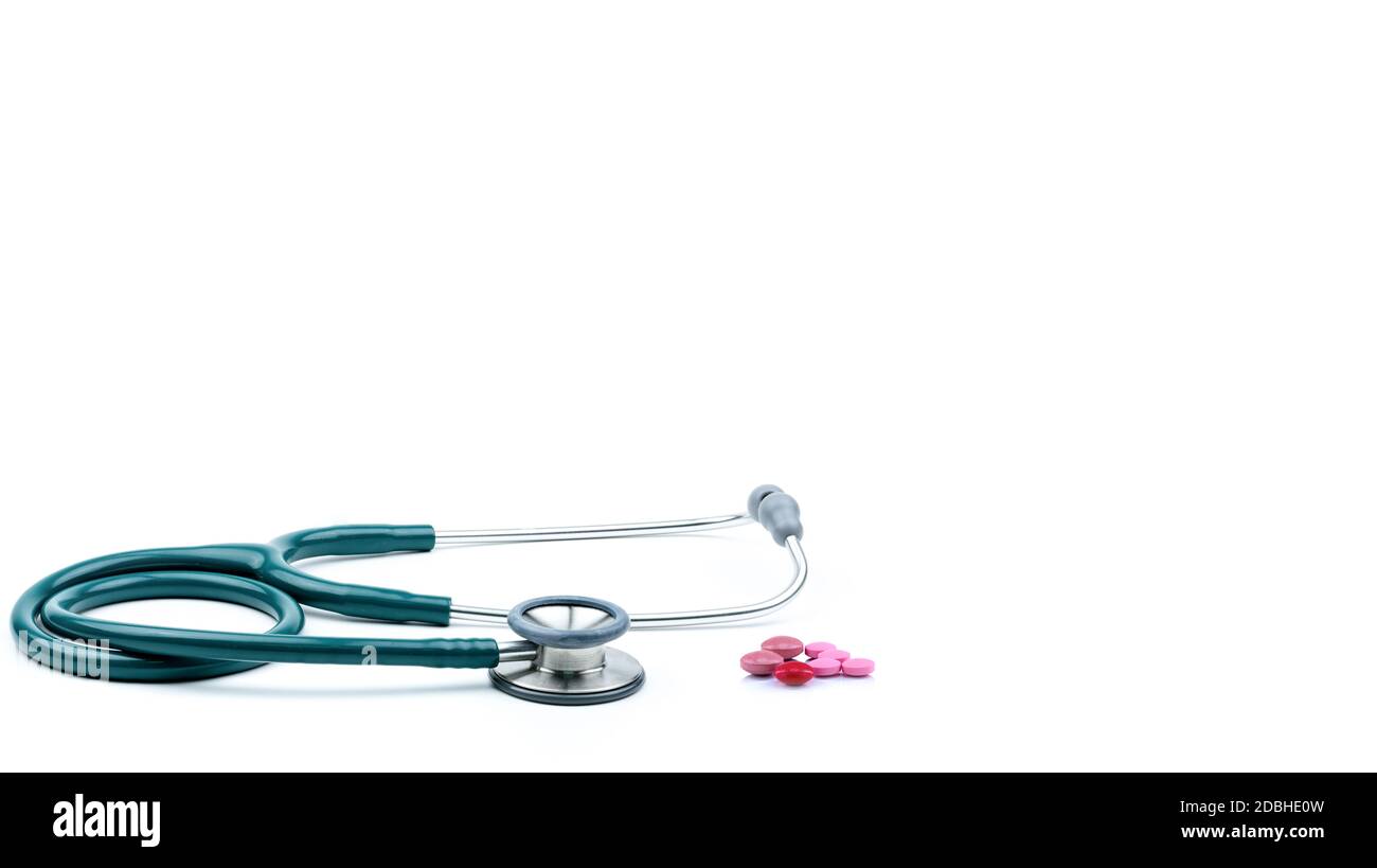 Green stethoscope with tablets pills isolated on white background with ...
