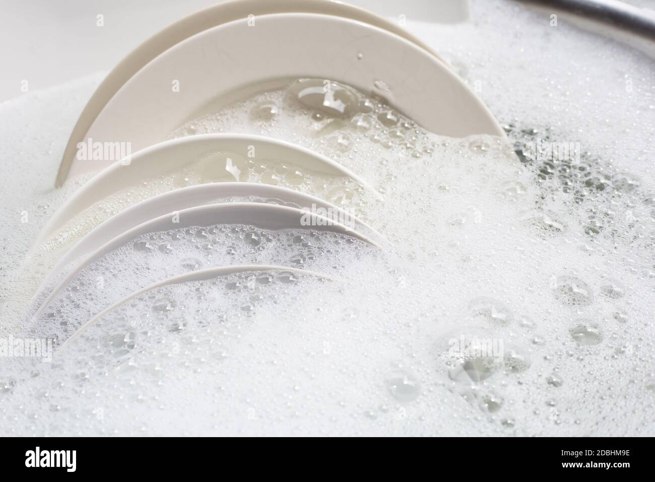 Dish washing, Dirty dishes soaking in kitchen sink Stock Photo Alamy