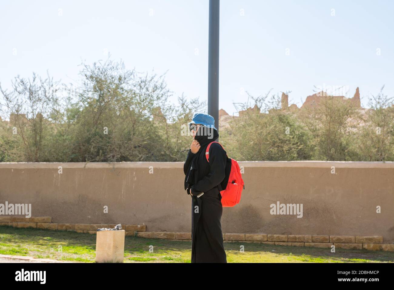 A woman wearing black hijab visiting the ruins of Diraiyah, also as Dereyeh and Dariyya, a town in Riyadh, Saudi Arabia Stock Photo