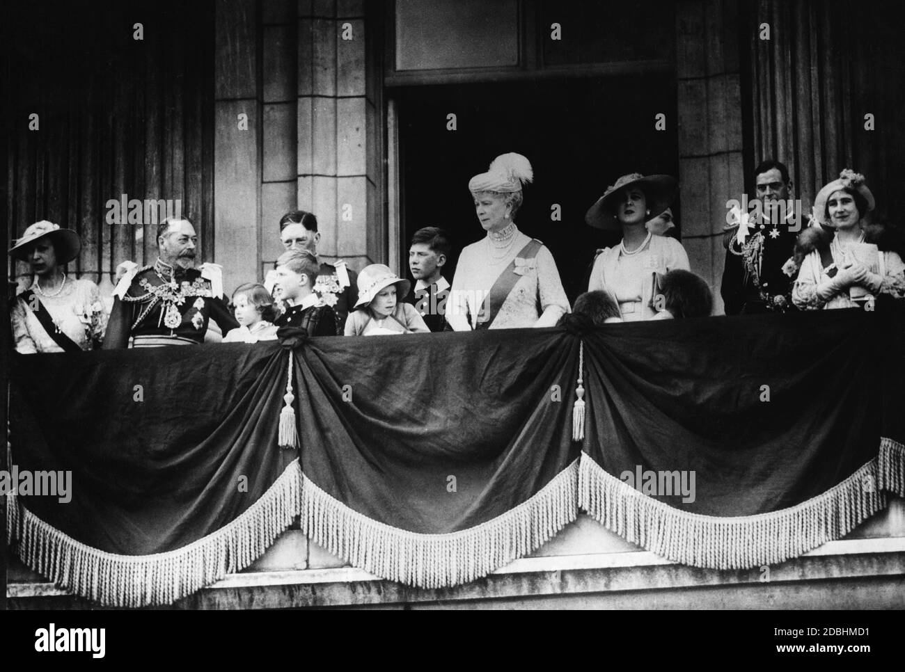 From left to right: Princess Mary, the former King George V, Princess Margaret Rose, Gerald Lascelles, Count George Lascelles of Harewood, Princess Elizabeth, Viscount Lascelles, the former Queen Mary, Countess Mary of Kent, Count Henry of Gloucester, Count George of Kent and Countess Elizabeth of York. Stock Photo