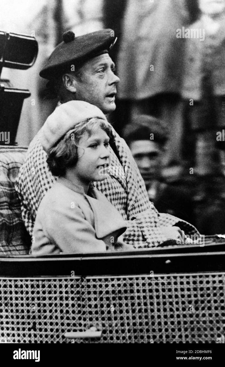 Princess Elizabeth and her uncle Prince Edward VIII in an open carriage on their way home to the castle after a church visit. Undated photo, ca. 1933. Stock Photo