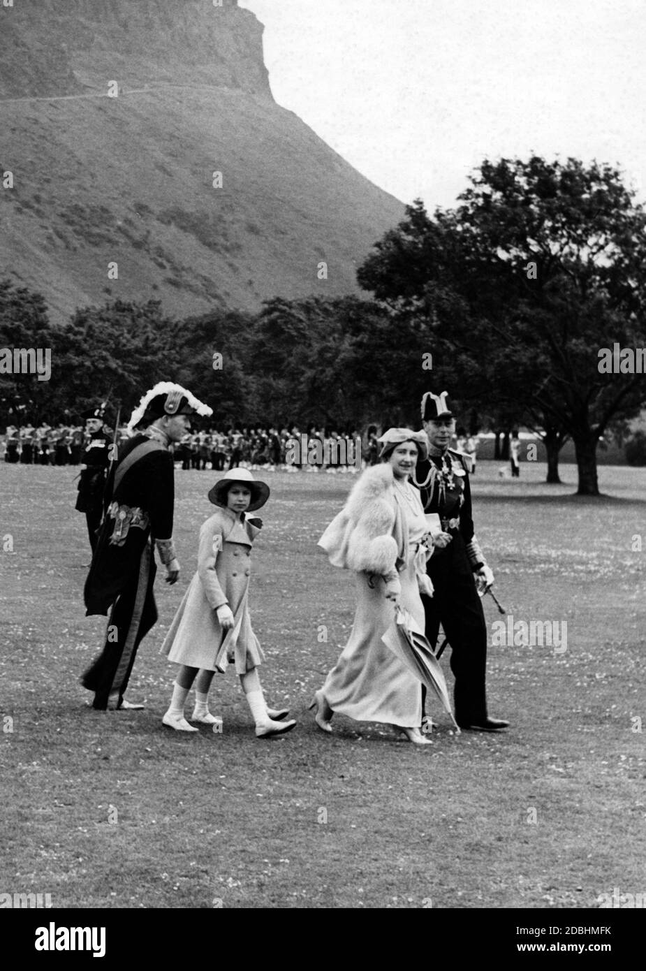Princess Elizabeth, Princess Margaret Rose (covered), Queen Elizabeth and King George inspecting the Royal Company of Archers at Holyroodhose in Scotland. Stock Photo