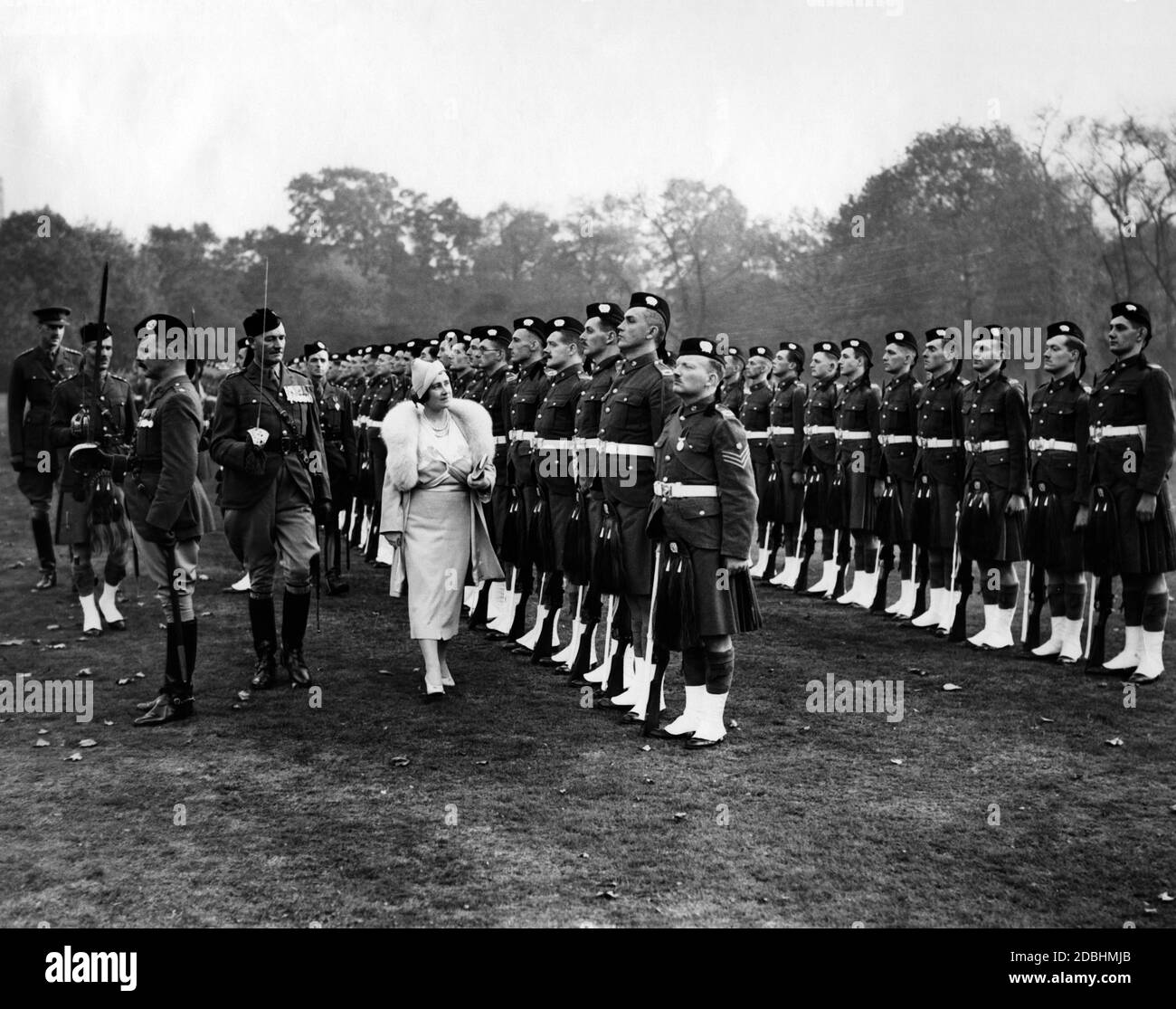 Queen Elizabeth inspects the ranks of the London Scottish. Undated photo, ca. 1937 Stock Photo