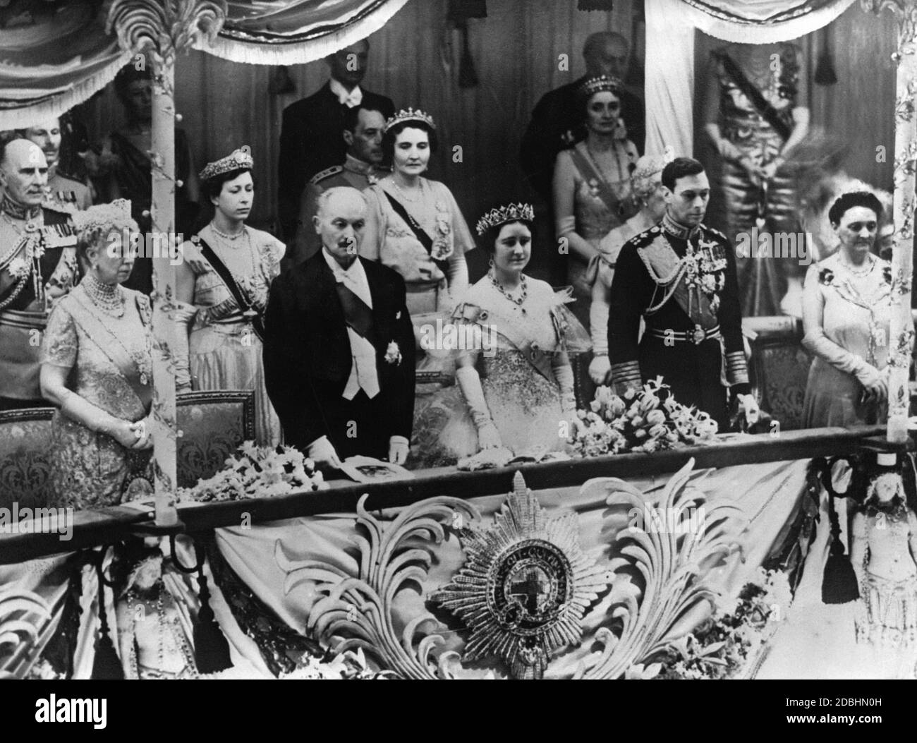 A diplomatic reception and a performance of the Vic-Wells Ballet took place at the Royal Opera House in honour of the state visit of French President Albert Lebrun. From left to right, first row: Queen Mary, Albert Lebrun, Queen Elizabeth, King George VI and Madame Lebrun. Second row: Duke Athlone and Princess Mary. Stock Photo