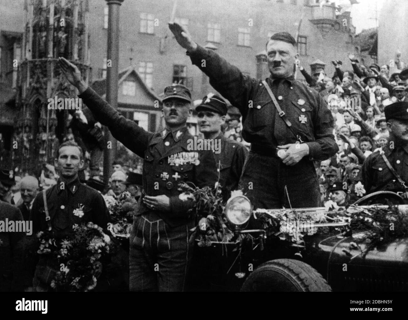 Left to right: Franz Pfeffer von Salomon (soon only von Pfeffer), Rudolf  Hess, Adolf Hitler and Uli Graf during the Nazi Party Congress in Nuremberg  on the Main Market Square. In the