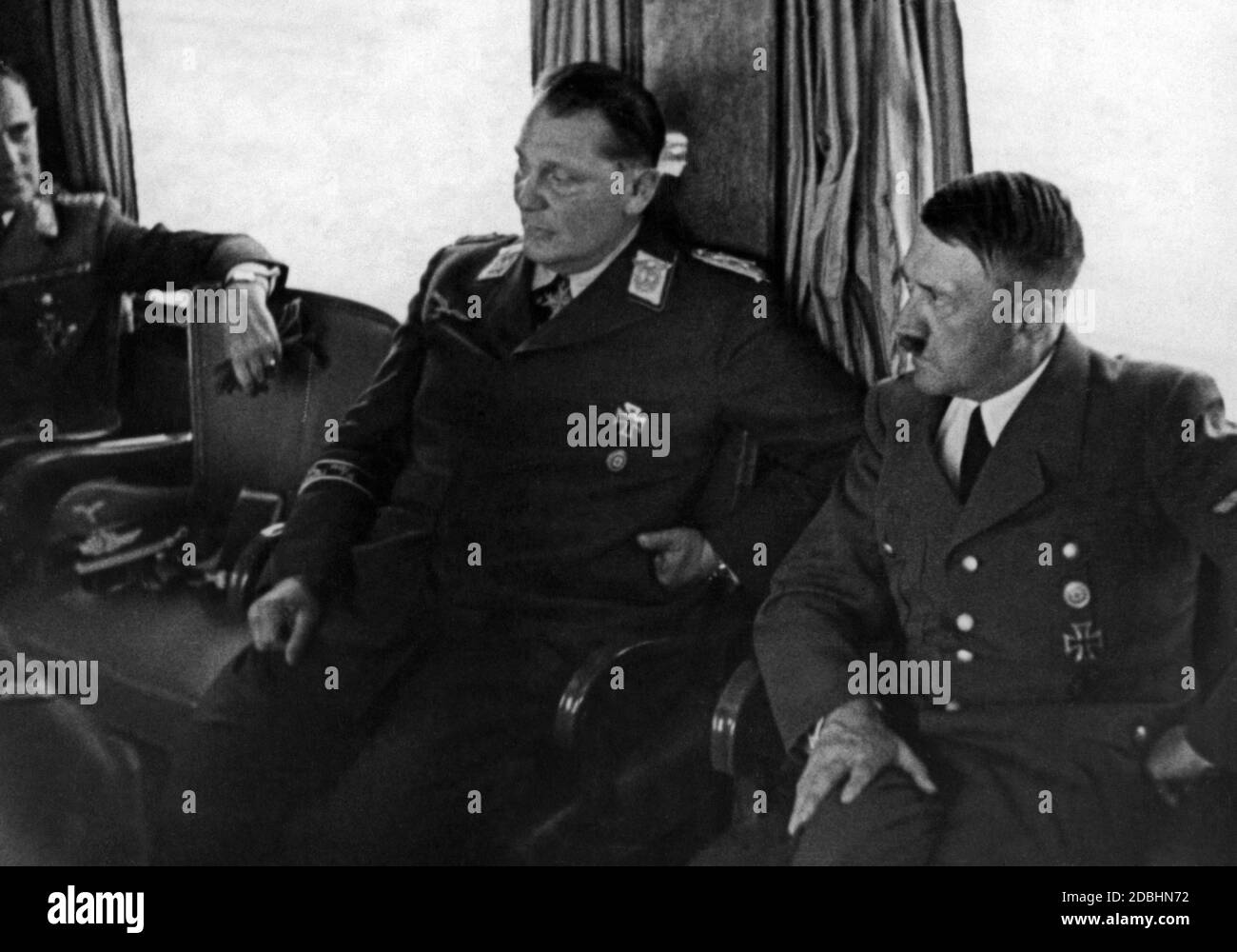 Adolf Hitler with Hermann Goering and Karl Bodenschatz in a special train during the campaign in Poland. Stock Photo