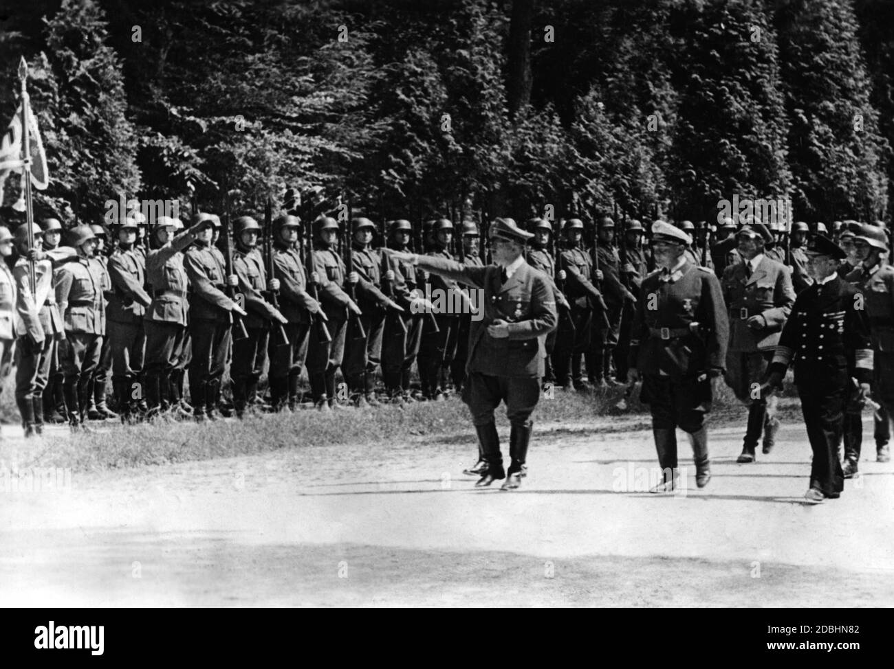 The colonels of the Navy and Air Force inspect Wehrmacht soldiers after they had defeated the French army after a short war. The next day, the Chief of OKW, Keitel, was to dictate the terms of the armistice to the French government on behalf of Hitler in the historic forest of Compiegene in the wagon in which the surrender of the German Empire was signed in 1918. The wagon had been transported here from a museum for this special purpose. Stock Photo