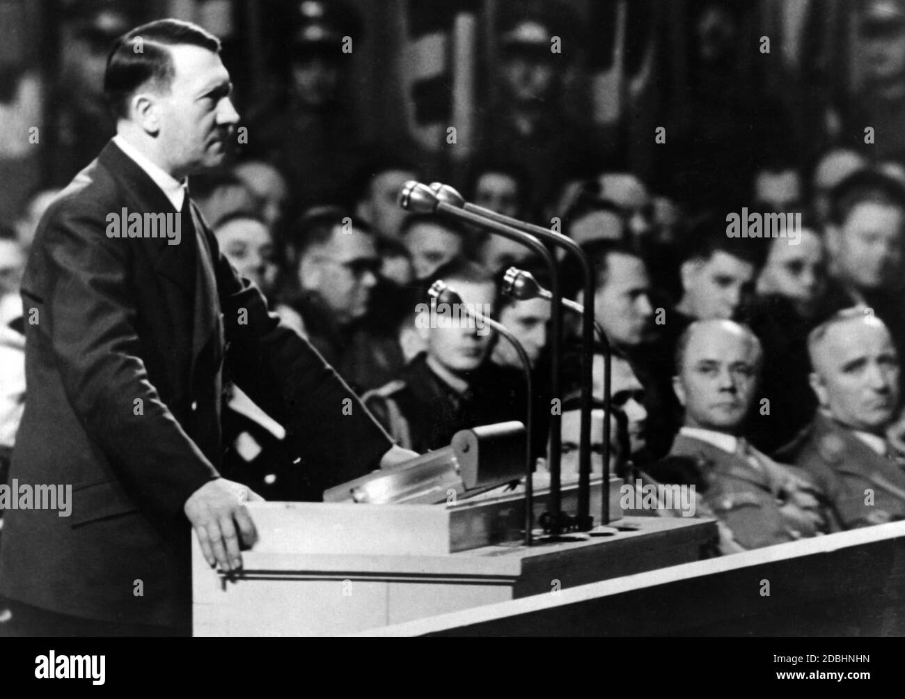 Adolf Hitler gives a speech at the Berlin Sportpalast on the occasion of the eighth anniversary of the seizure of power. In the background are Goebbels, Hess and Robert Ley. Between Hess and Ley is probably Karl Wahl. Stock Photo