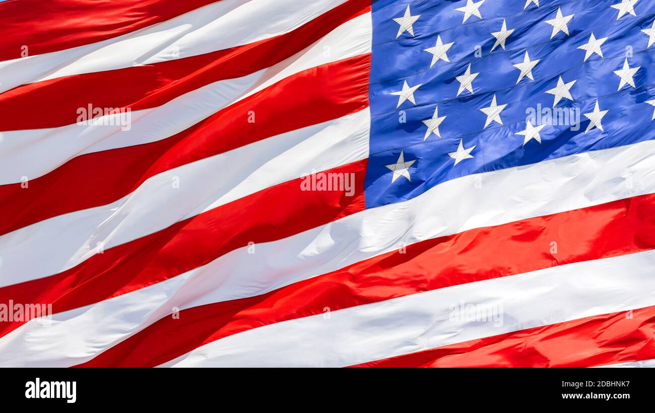 American flag waving in the wind, US flag motion close-up, United States of America national flag. USA stars and stripes Stock Photo