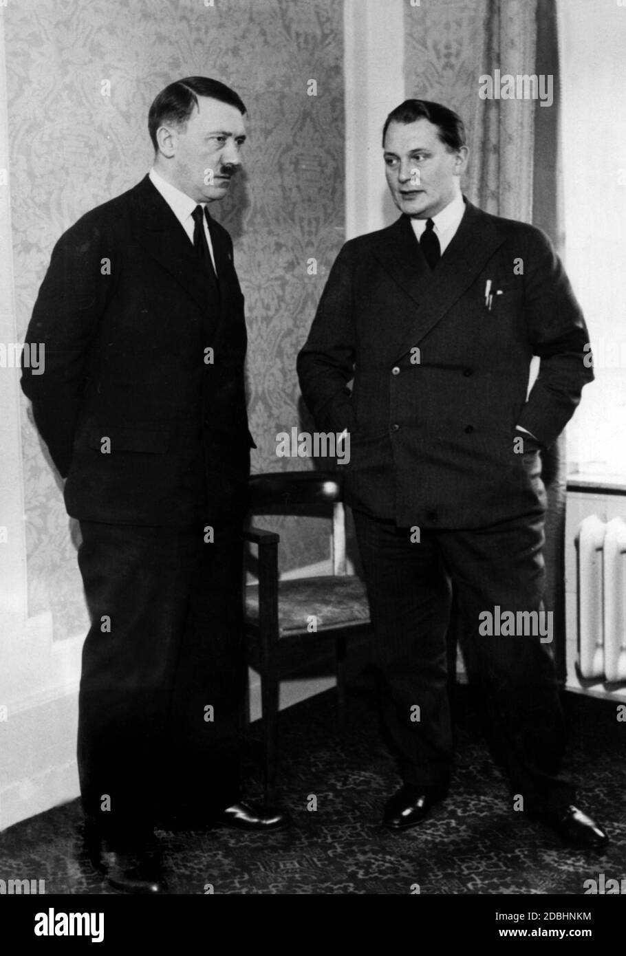 Adolf Hitler, together with Hermann Goering, is expecting a delegation of foreign journalists at the Kaiserhof Hotel in Berlin, who he informed about his foreign policy positions. Stock Photo