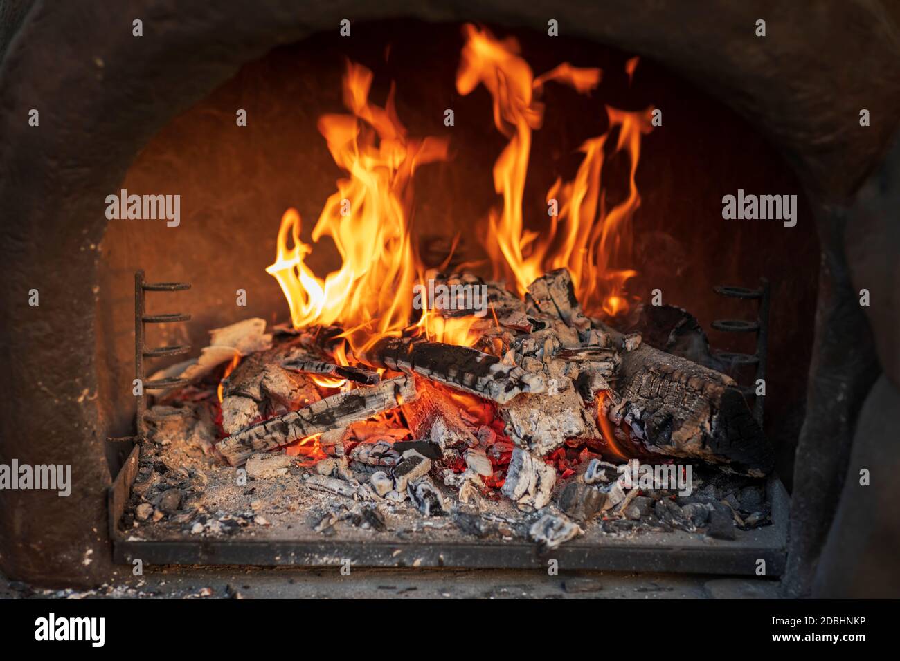 Wood burning in empty barbecue grill Stock Photo