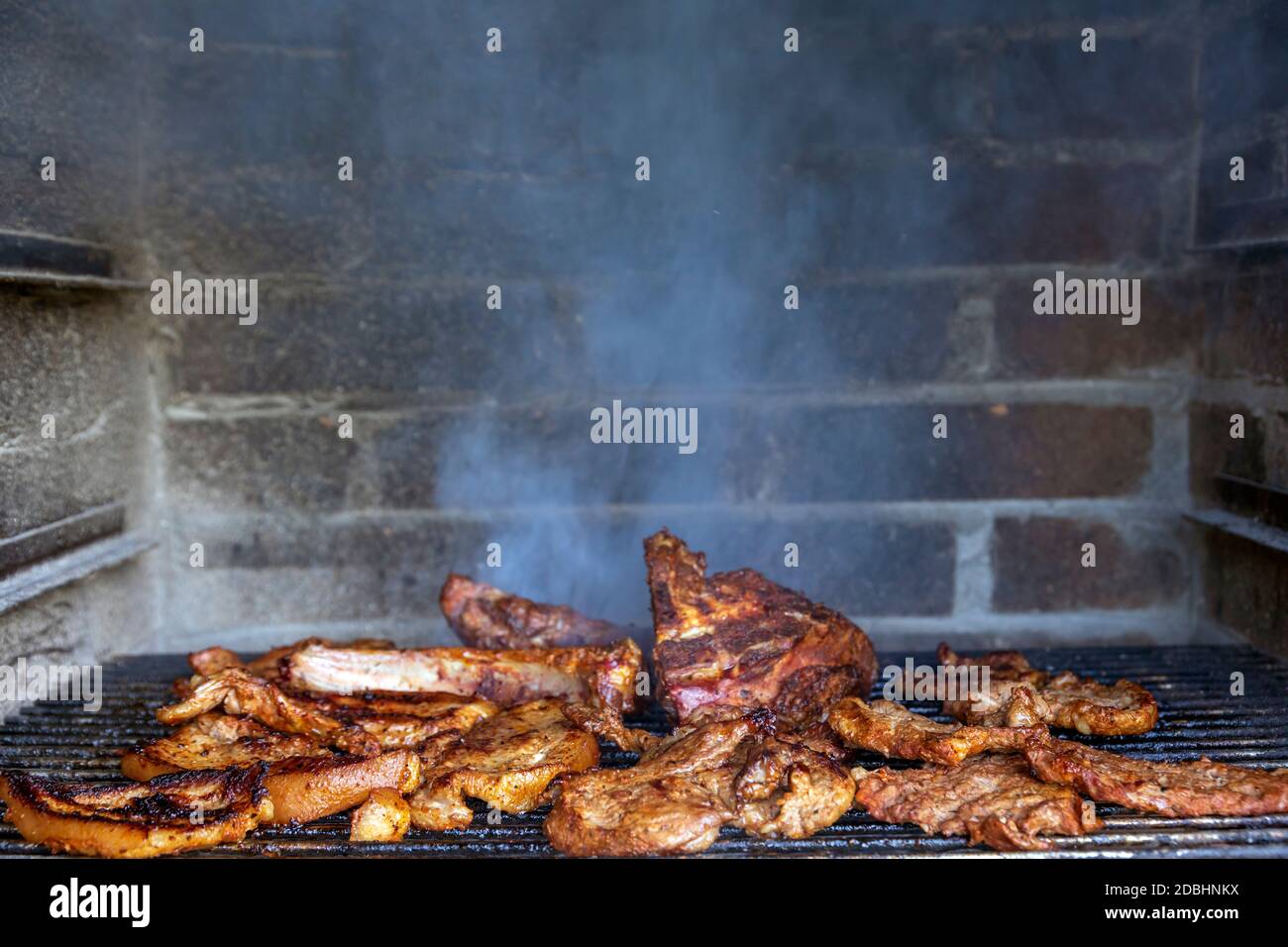 Meat on the barbecue grill, beef steak Stock Photo