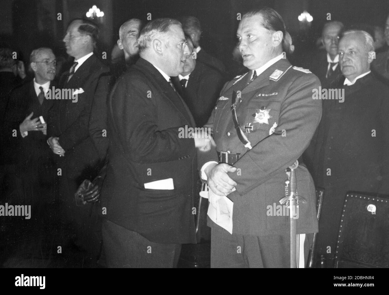 Hermann Goering in conversation with Reich Minister of Labour Franz Seldte at the opening of the Reich Chamber of Culture. Behind Seldte is Wilhelm Frick. Stock Photo