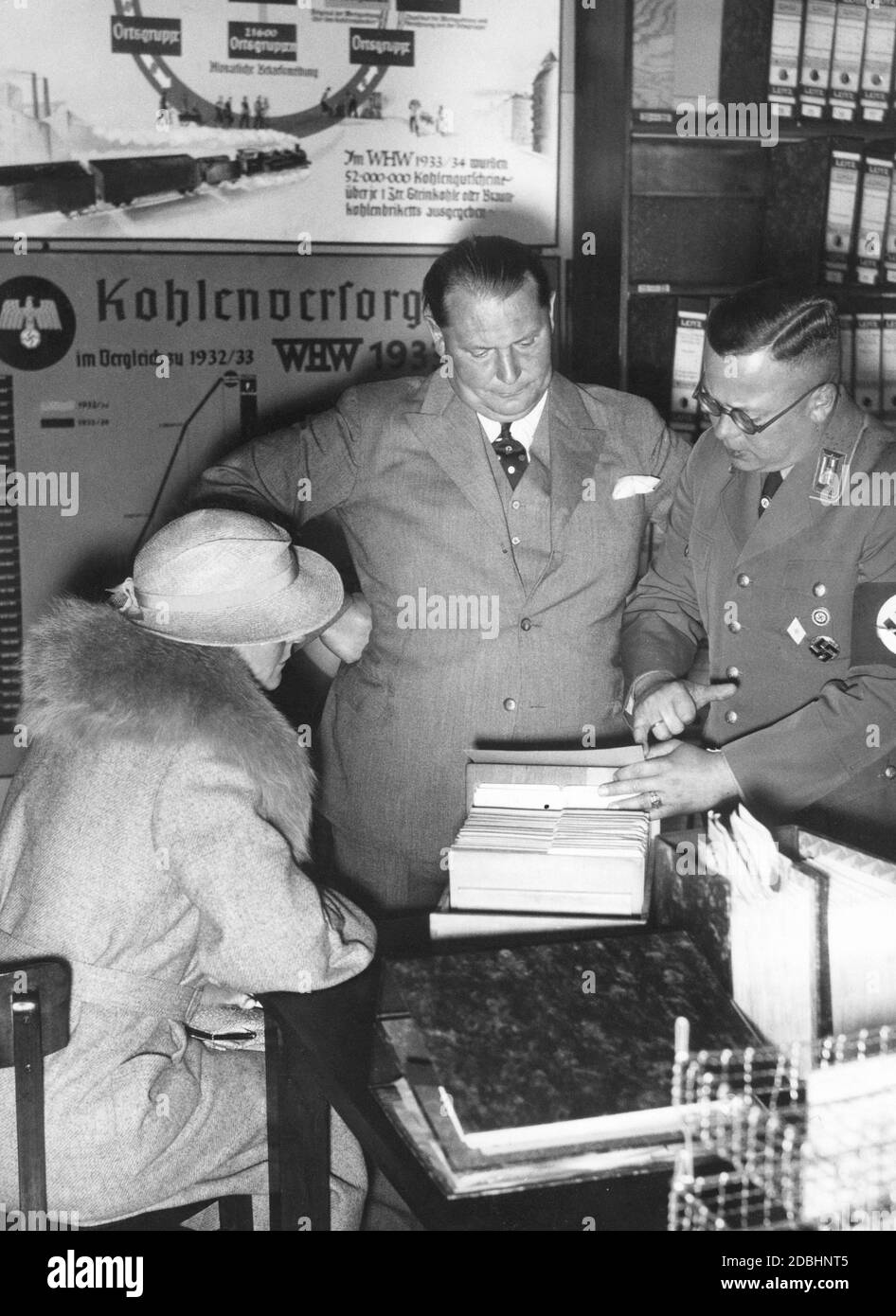 Hermann Goering and his wife Emmy Sonnemann visiting the NSV-Haus on the Maybachufer in Berlin. Reichsoberrevisor Janowski explains the mechanisms of coal supply to him. Stock Photo